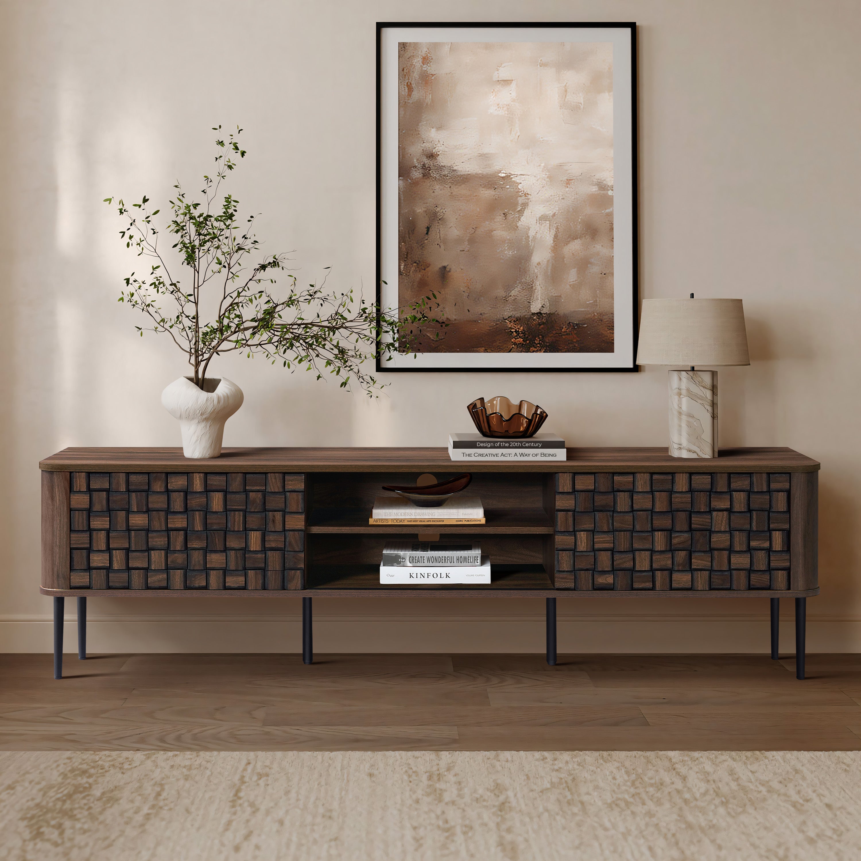 Mid-century modern wooden console table with ample storage, topped with decorative items like a vase with branches.