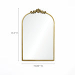 The LuxenHome Rêverie mirror features a vertical arch with an intricate vintage gold metal frame and decorative top. This stunning wall decor piece measures 31.5 inches high and 19.88 inches wide.