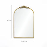 The LuxenHome Rêverie mirror features a vertical arch with an intricate vintage gold metal frame and decorative top. This stunning wall decor piece measures 31.5 inches high and 19.88 inches wide.