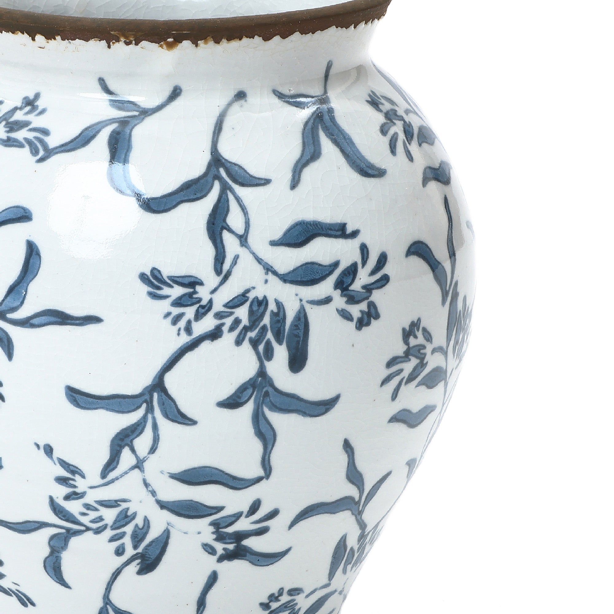Handcrafted floral ceramic vase with a narrow rim, featuring elegant blue leafy branch patterns.