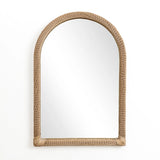 A decorative hanging mirror with an arched rectangular design features a rattan frame, elegantly mounted against a plain white background.