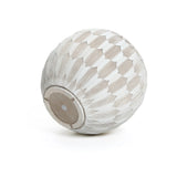 A LuxenHome 11.81 high round planter features a geometric feather-like pattern with alternating white and beige segments. Its bottom has an opening with a circular detail, indicating its made from durable MgO and fiberglass.