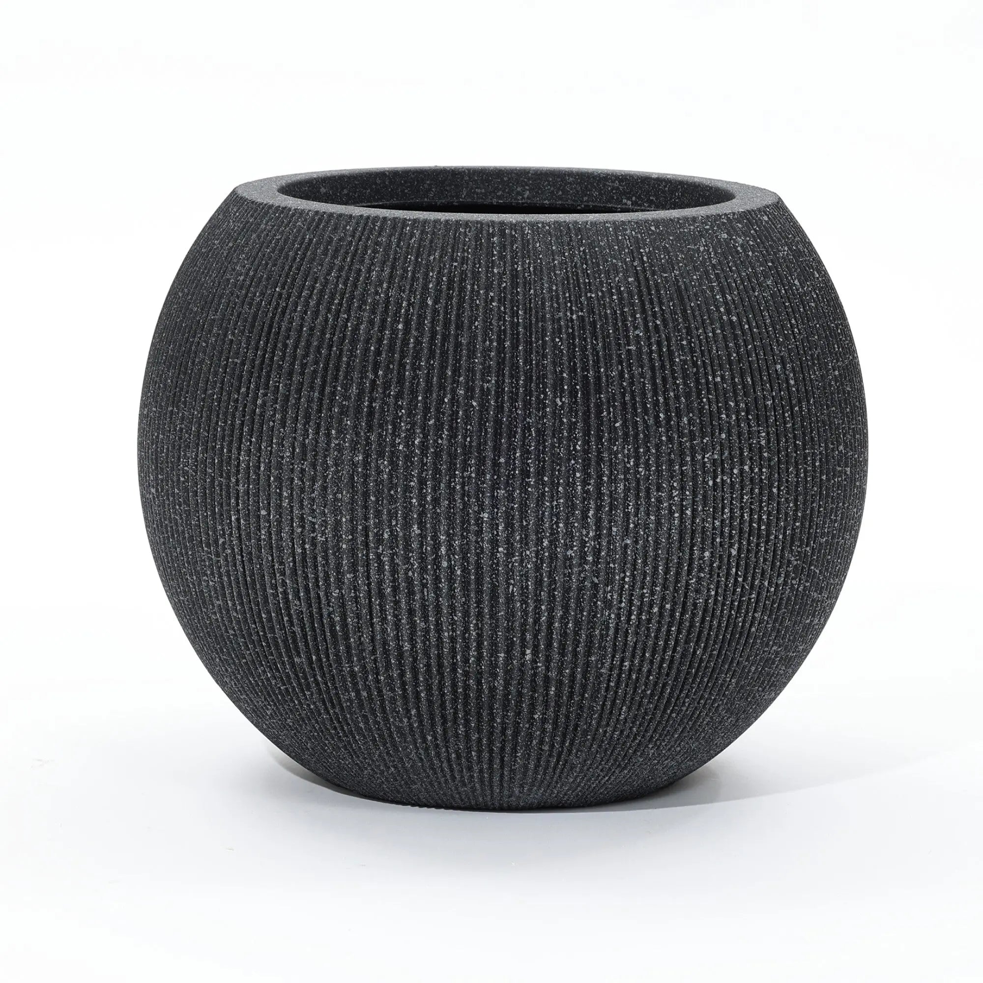 A round, textured black modern planter with a wide opening is set against a plain white background. Ideal for both indoor and outdoor spaces, this piece is crafted from durable polyethylene to withstand the elements while maintaining its sleek style.