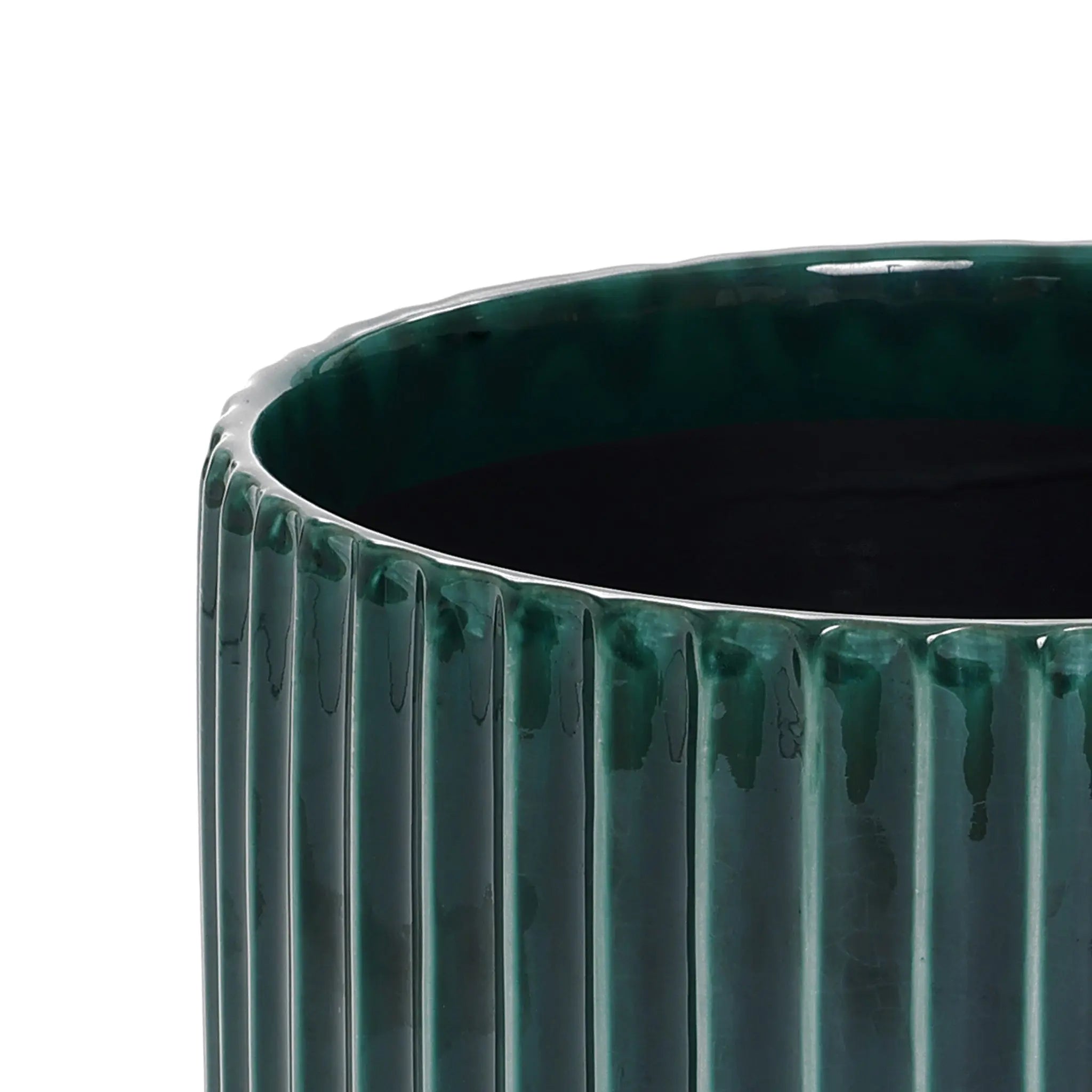 A LuxenHome Jade green ribbed glazed round ceramic planter, 13 high, with a glossy finish features a smooth top edge that reveals its depth and adds vibrant natural beauty to any space.