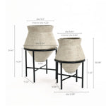Two vintage distressed style beige cachepot planters on black stands, perfect for enhancing your indoor space decor. Each planter boasts detailed measurements for diameter and height, ensuring a perfect fit for any room.