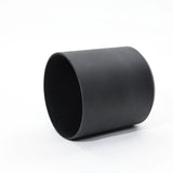 A durable black cylindrical pot is artfully placed on its side against a white background, showcasing its versatility as both indoor and outdoor decor. Ideal for those seeking stylish planters to elevate their garden or patio aesthetics.