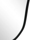 The curved edge of an asymmetrical mirror complements the sleek, frameless design against a plain background, embodying modern minimalism.