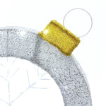 Silver and gold ornamental decoration with a snowflake pattern seamlessly blends into a circular Christmas decor, creating the perfect holiday decoration.