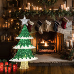 A cozy fireplace with a burning fire and a decorated mantle, featuring stockings and candles as part of the holiday decor. An illuminated Christmas tree adorned with LED lights sits nearby, with gift boxes scattered on the floor.