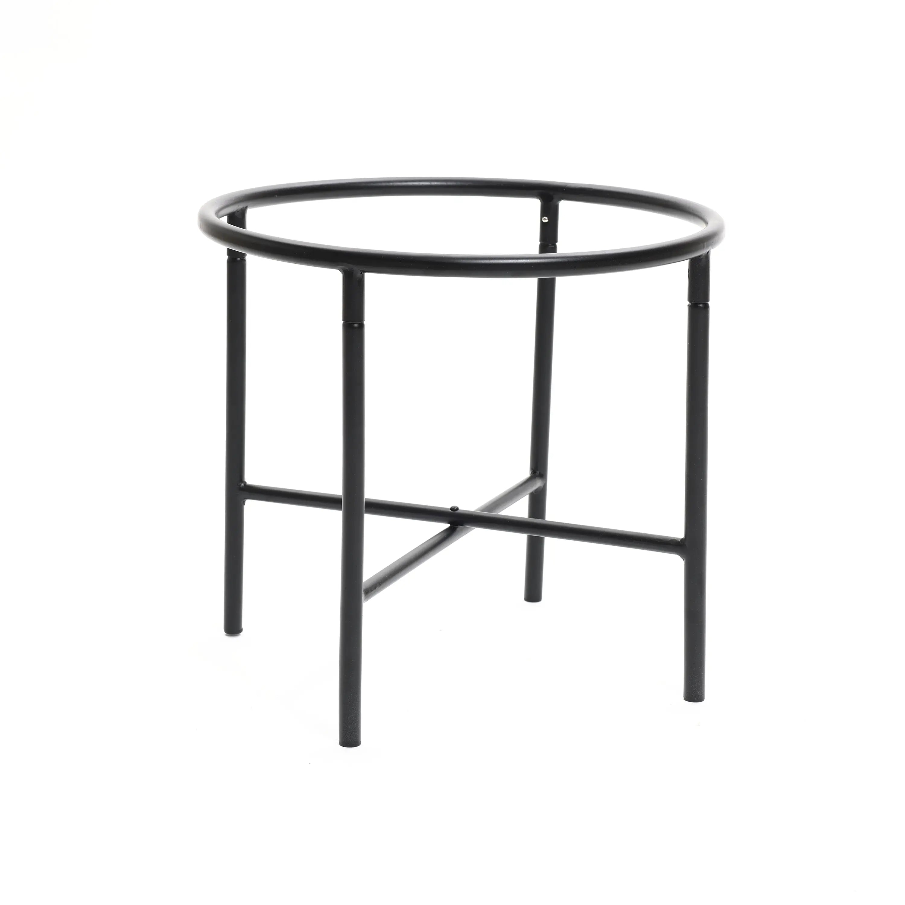 A black, round metal table with four legs and a crossbar support adds a touch of vintage distressed style to any indoor space decor.