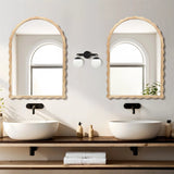 Double vanity setup featuring two rubberwood round sinks complemented by 34-inch arch mirrors with scalloped edge framing, and central lighting. Neutral tones and small plants enhance the minimalist aesthetic.