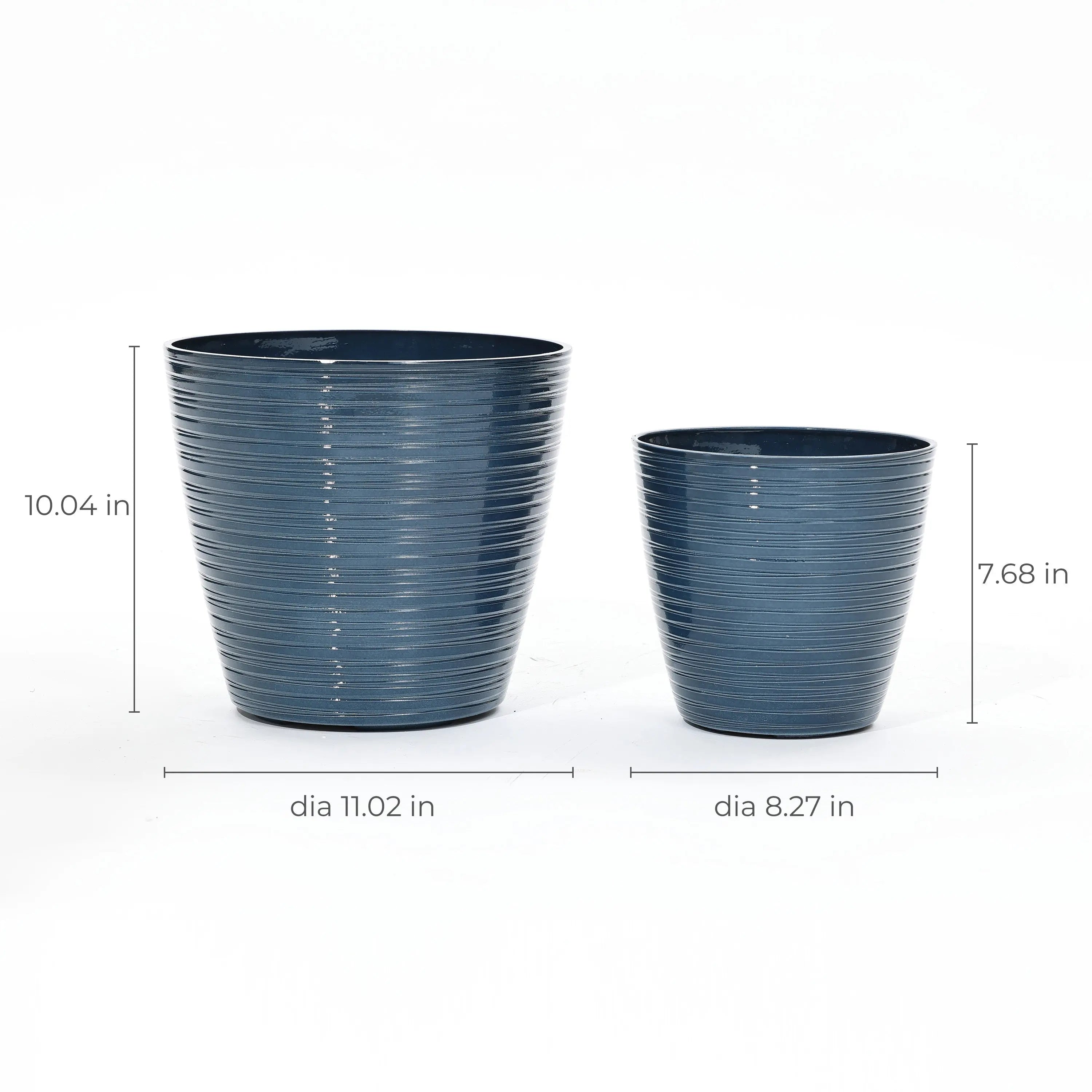 Two blue cylindrical decorative planters, perfect for indoor and outdoor use, feature horizontal grooves. The larger measures 10.04 tall with an 11.02 diameter, while the smaller is 7.68 tall by 8.27 in diameter. Finished with UV protection, they create a charming display against a white background.