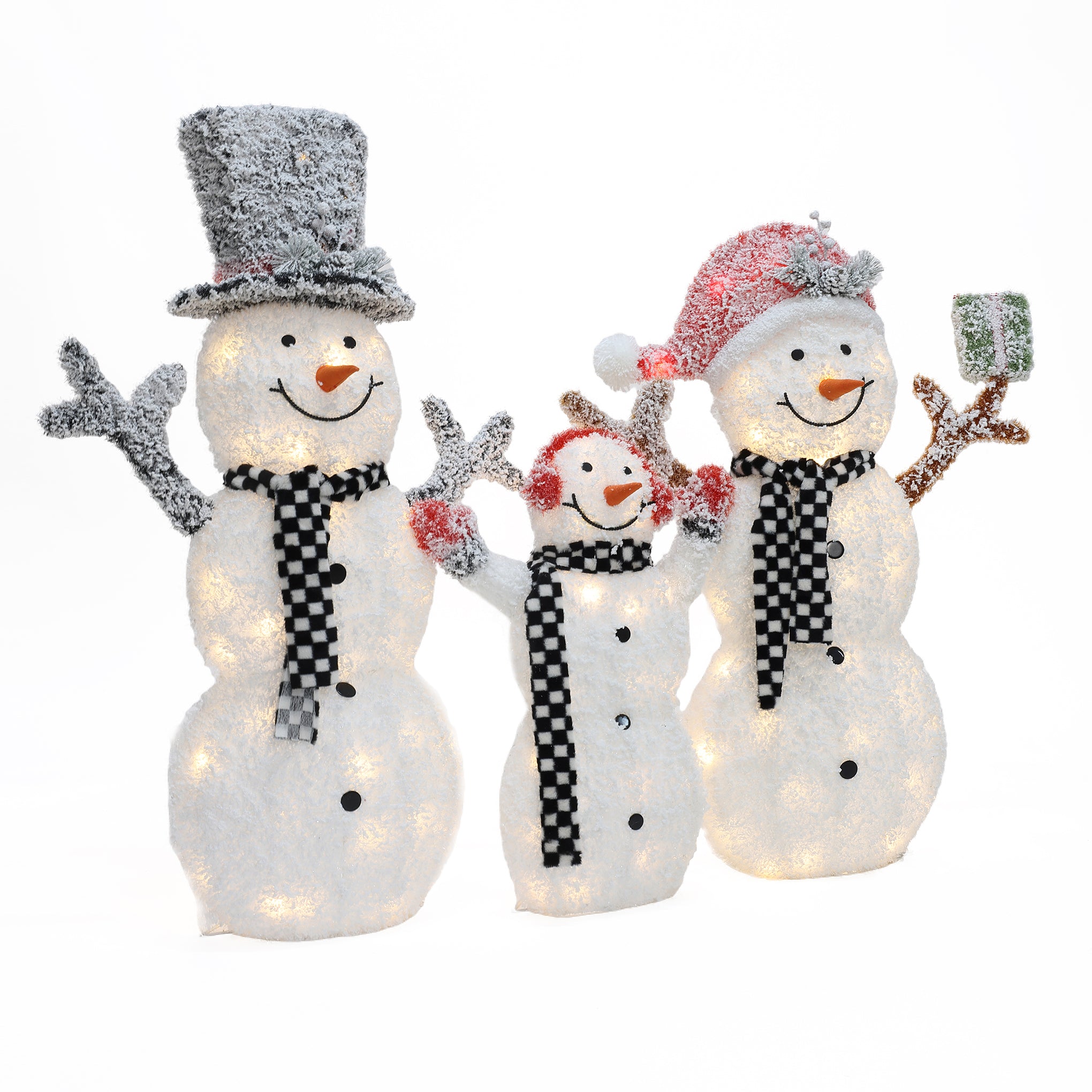 Three illuminated snowmen, the perfect outdoor Christmas decor, stand together waving—one in a top hat, one in a Santa hat, and the smallest in earmuffs—all sporting black and white scarves for a charming lighted snowman display.