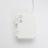 White plastic control box with small button, printed ON/OFF options. A single wire extends from the top.