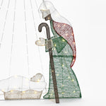 A lit wire-frame nativity scene featuring a shepherd with a staff and a baby in a manger, illuminated by LED bulbs, makes for an enchanting Christmas decoration. Complete with the guiding presence of the North Star, it captures the essence of this cherished holiday tradition.