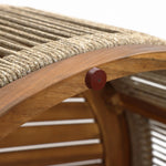 Close-up of a wooden chair crafted from acacia wood, featuring a curved frame and hand-woven rope seat. A small round red accent is attached to the frame, making it perfect for both indoor and outdoor settings.