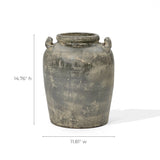 The Fou antique terracotta vase by LuxenHome is a weathered, cylindrical ceramic piece with a rustic texture, featuring two small handles near the rim. It measures 14.76 inches in height and 11.81 inches in width, embodying an artisanal charm and timeless elegance.