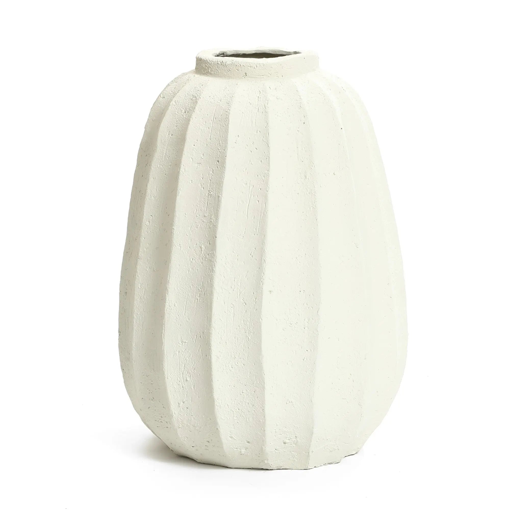 A cream-colored, textured, fluted ceramic vase with a narrow opening makes for an artistic centerpiece, perfect for minimalist home decor.
