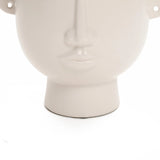 The LuxenHome White Ceramic Bust Head Vase, 9.6 high, showcases a minimalist human face design with sleek contours and a smooth finish, elegantly set against a plain white background.