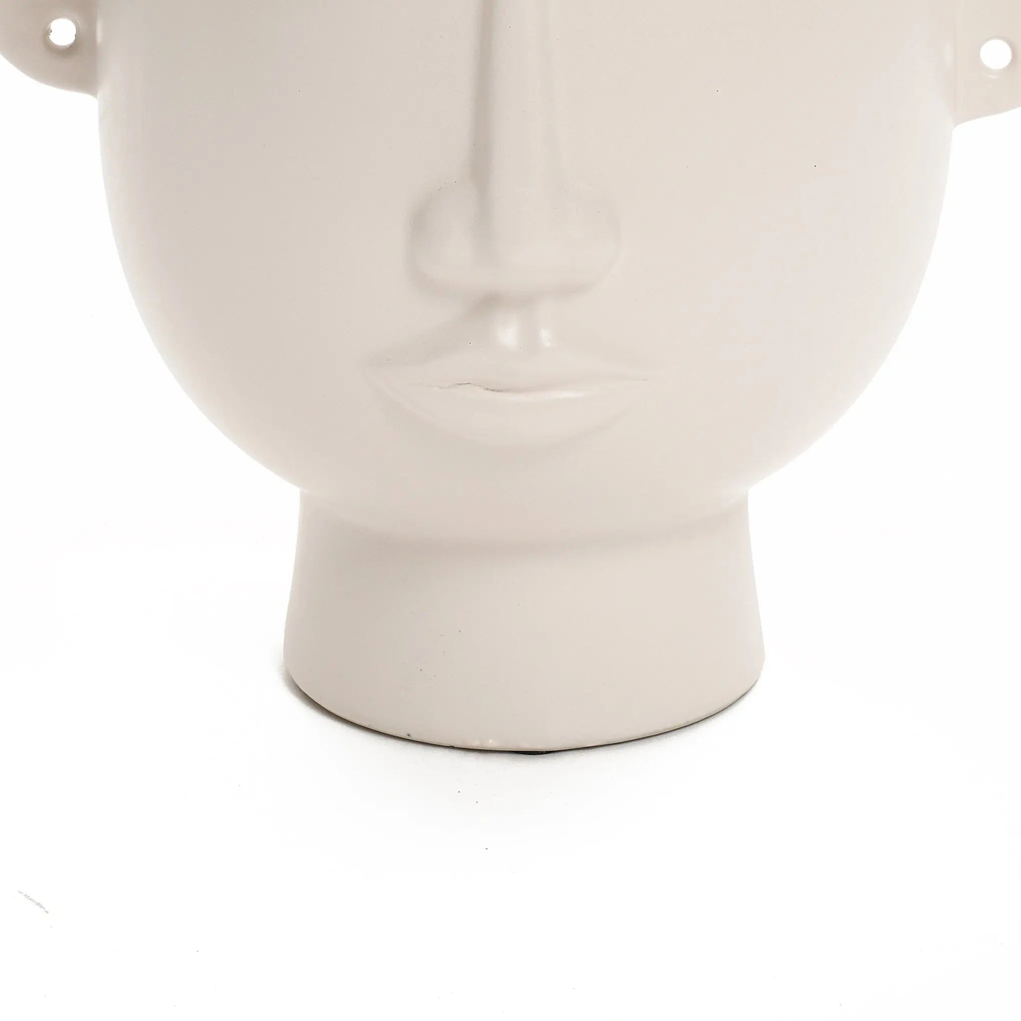 The LuxenHome White Ceramic Bust Head Vase, 9.6 high, showcases a minimalist human face design with sleek contours and a smooth finish, elegantly set against a plain white background.