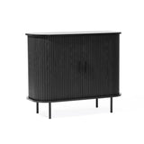 The LuxenHome Aria 2-door tambour accent cabinet, in a black finish, features sleek vertical slats and smooth corners. Standing on four slender legs, its minimalist design seamlessly merges mid-century modern flair with various interior styles.