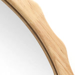 Close-up of a 34-inch Arch Mirror featuring a wavy wooden frame with scalloped edge framing, set against a plain background.