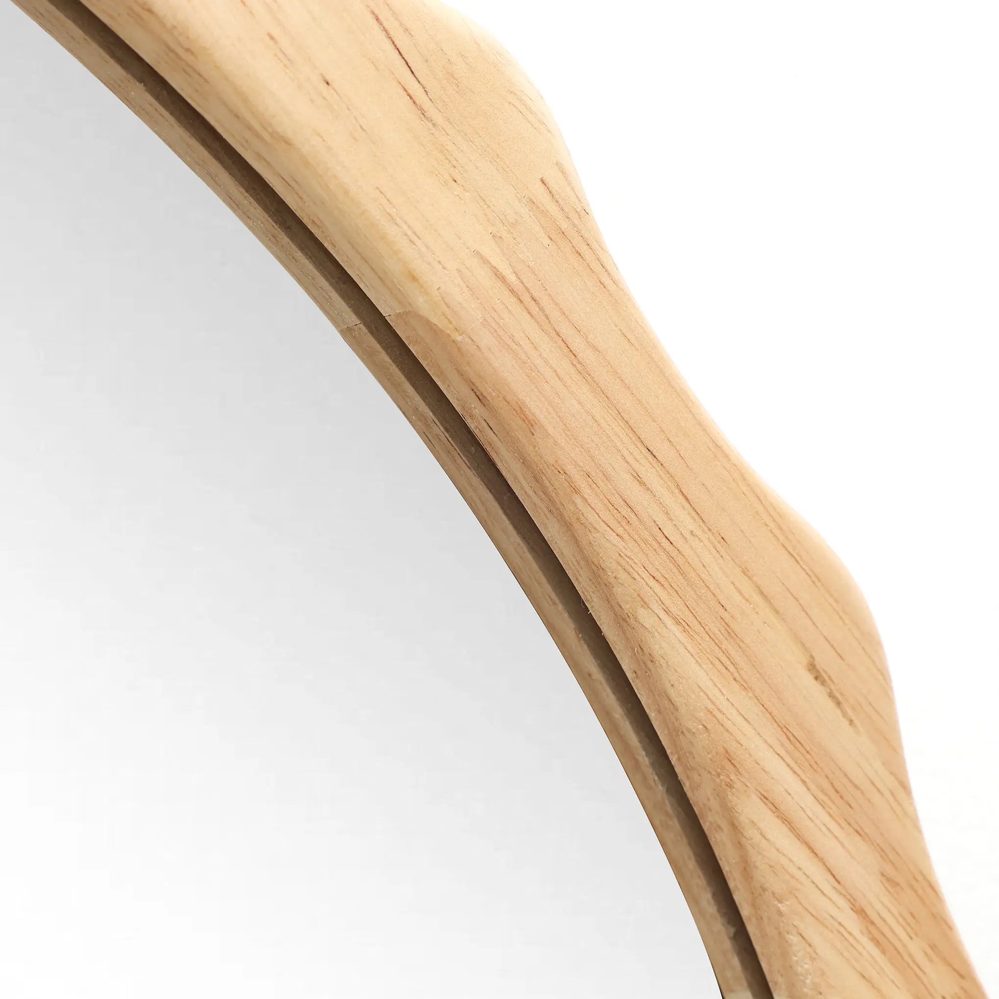 Close-up of a 34-inch Arch Mirror featuring a wavy wooden frame with scalloped edge framing, set against a plain background.