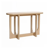 The Lorean natural finish contemporary console table by LuxenHome features an oval top with modern geometric design, oval cutout legs connected by a rectangular base, offering an open, airy look. Its minimalist style and sleek wood finish add a contemporary touch to any space.