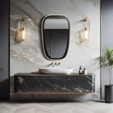 Modern bathroom with a marble wall and an oblong-shaped, contemporary mirror framed in black. A floating black vanity sits below, flanked by two wall lights. A potted plant adorns the floor.