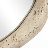 Close-up of a weathered, light brown wooden frame with a smooth curve, featuring visible grain and small holes, surrounding an oval wall mirror. This piece enhances home decor by blending rustic charm with elegant design.