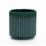 A Jade green ribbed glazed ceramic planter from LuxenHome, standing 13 high, showcases its vibrant natural beauty against a plain white background.