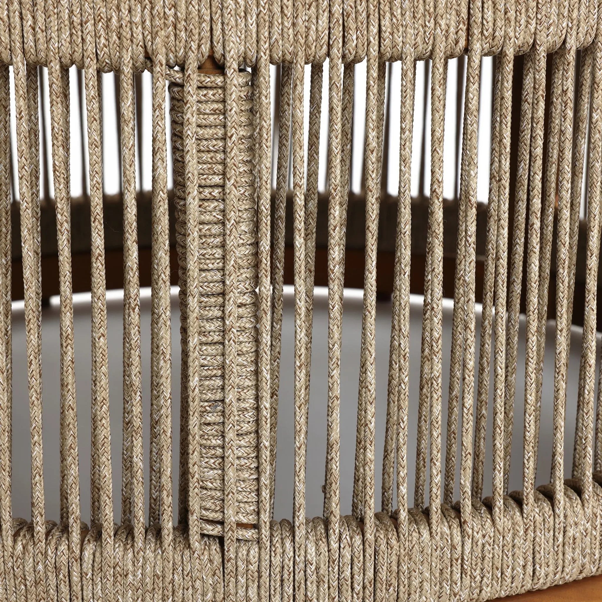 Close-up of hand-woven rope strands wrapped around an acacia wood frame, creating a stylish vertical striped pattern suitable for both indoor and outdoor spaces.