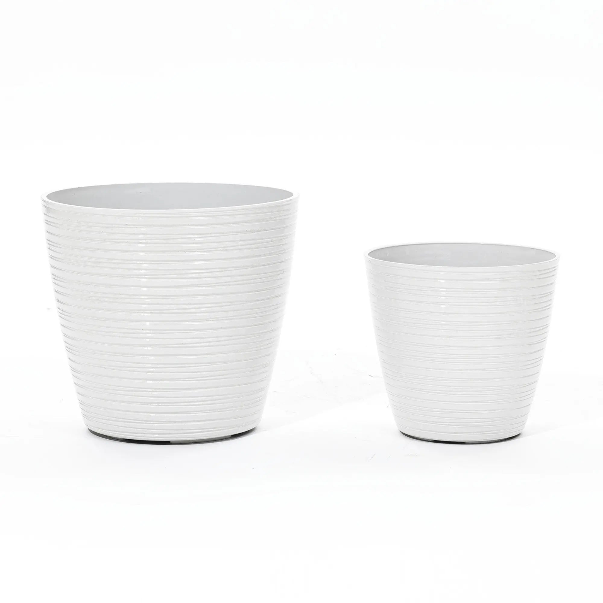 Two decorative planters with a ribbed design stand side by side against a white background. These versatile pieces come in different sizes and are perfect for both indoor and outdoor use, adding style to any space.