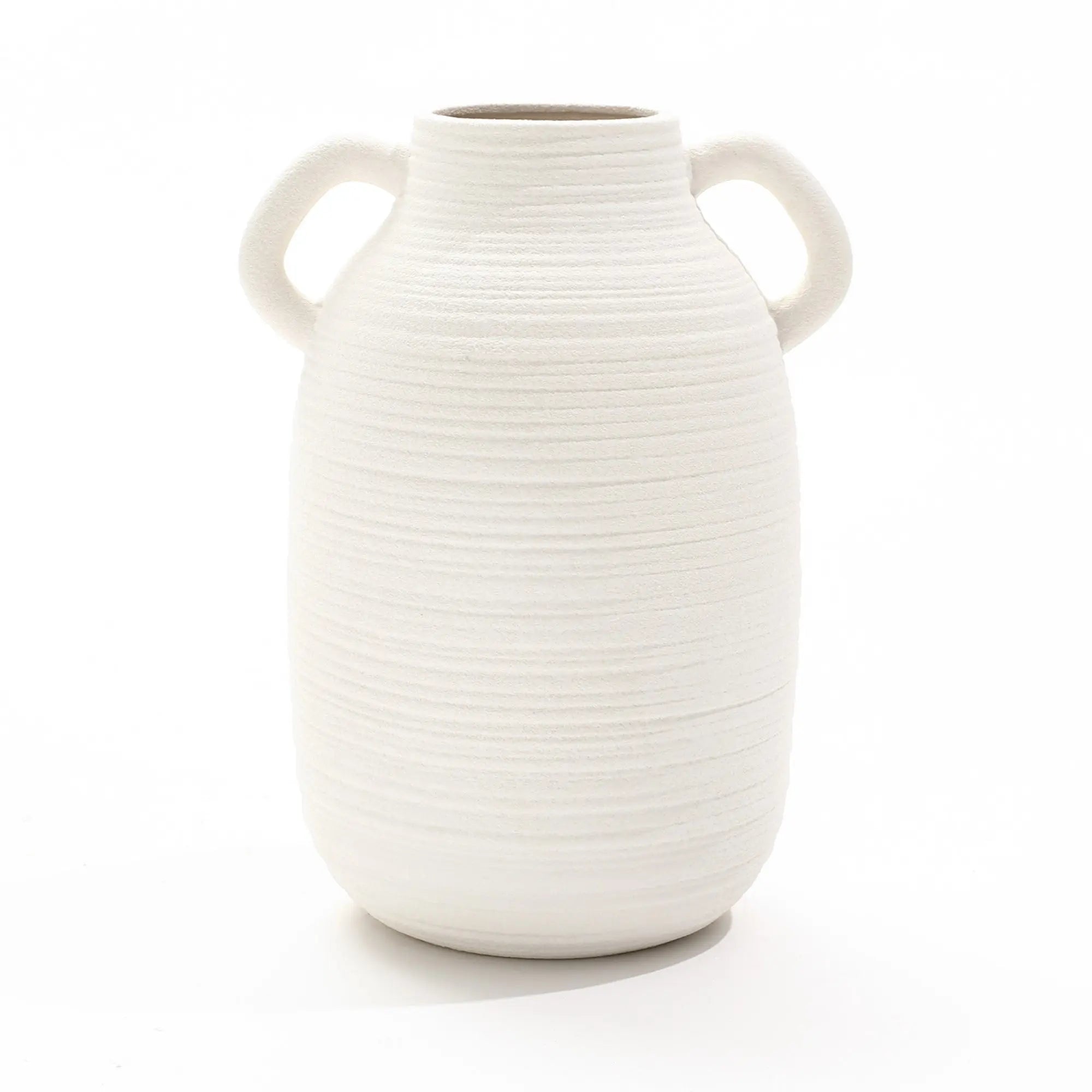 White ceramic vase with a textured surface and two side handles, exuding rustic charm, set against a plain white background.