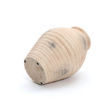 The LuxenHome Rustic beige ribbed terracotta urn vase, 13.2 h, reminiscent of an ancient amphora, is displayed on its side. Its handcrafted surface features patches of discoloration for a rustic look. The plain white background accentuates the ribbed texture and elegant form of this unique piece.