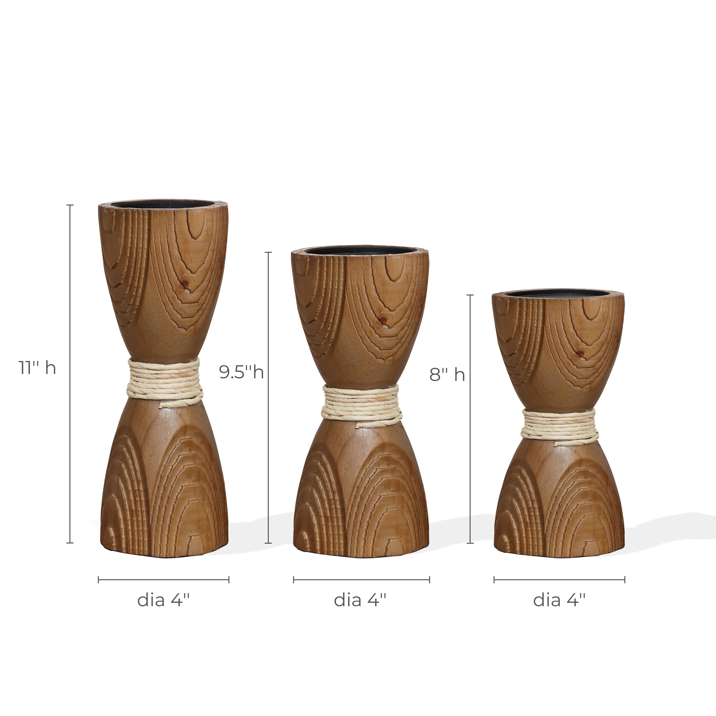 Three handcrafted wooden hourglass-shaped vases of different heights (11, 9.5, 8) and diameters (4), each accented with a rope detail around the middle, capture a rustic charm reminiscent of rattan design. Perfect for adding warmth or as unique candle holders to illuminate any space.