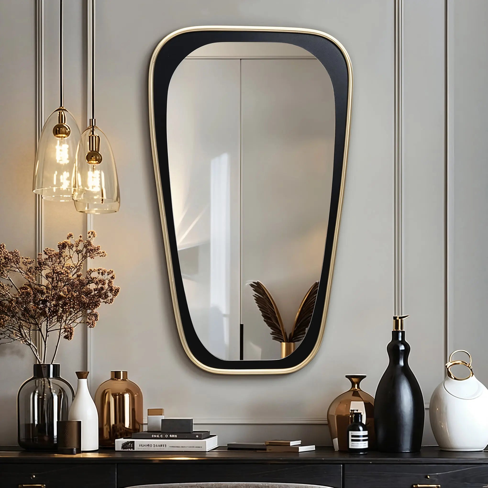 A modern living room featuring an elongated mirror for distortion-free viewing, pendant lights, vases, books, and a small sculpture elegantly arranged on a shelf.