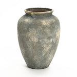 The LuxenHome Rustic gold and brown terracotta urn vase, standing 15.2 high, has a wide, round body tapering to the base with a weathered gray finish and subtle brown specks. Its narrow top opening adds charm as it elegantly stands against a plain white background.