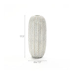 The LuxenHome Modern Geometric Pattern Resin Tall Vase is a 17-inch tall cylindrical piece featuring an antique effect and textured design, creating a striking presence against the plain white background.