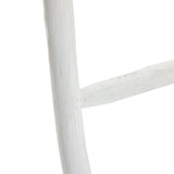 Close-up of a rustic, white-painted wooden blanket ladder with visible grain and texture, embodying rustic charm.