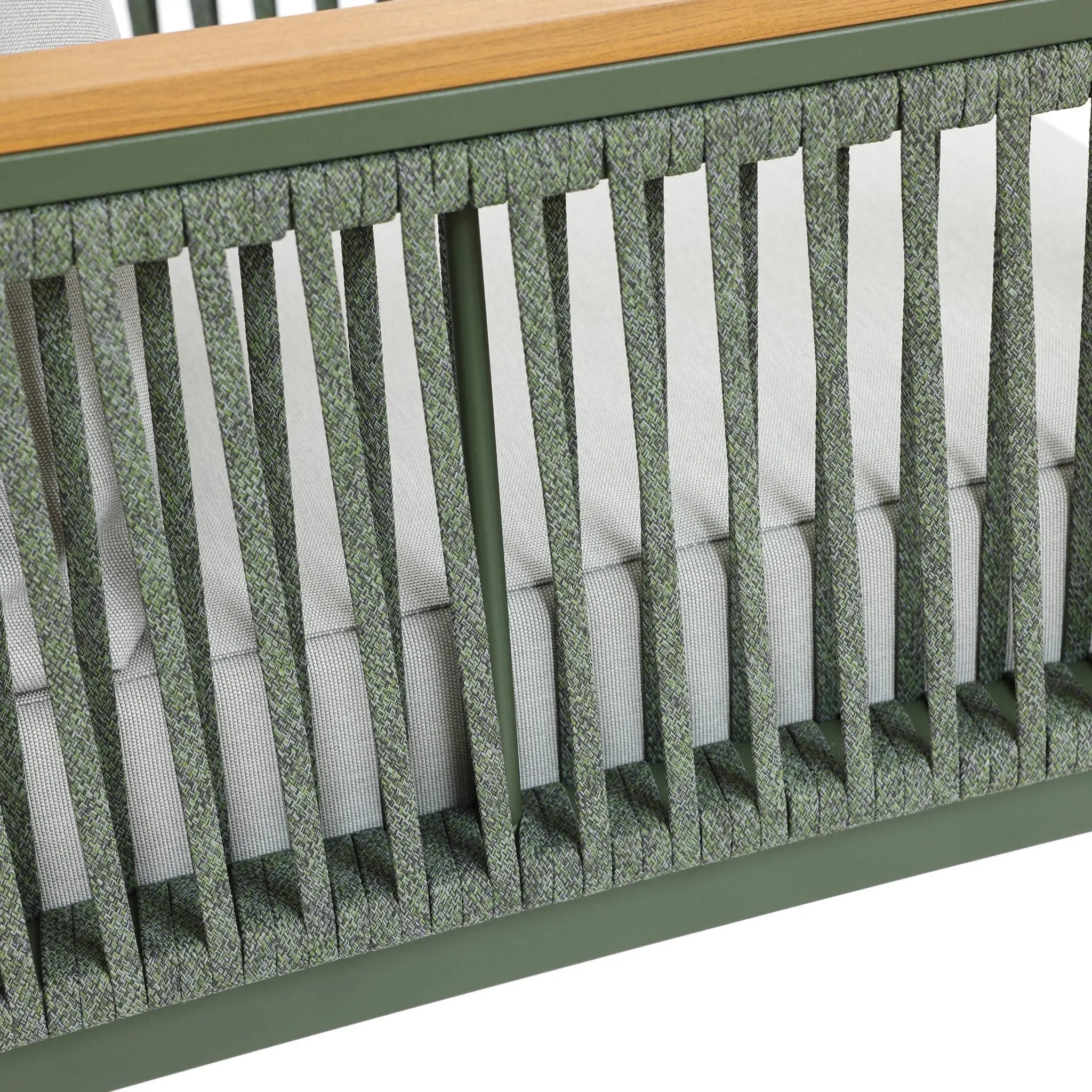 Close-up of a green woven pattern on a chair with plush cushions and wooden armrest, featuring a durable aluminum alloy frame.