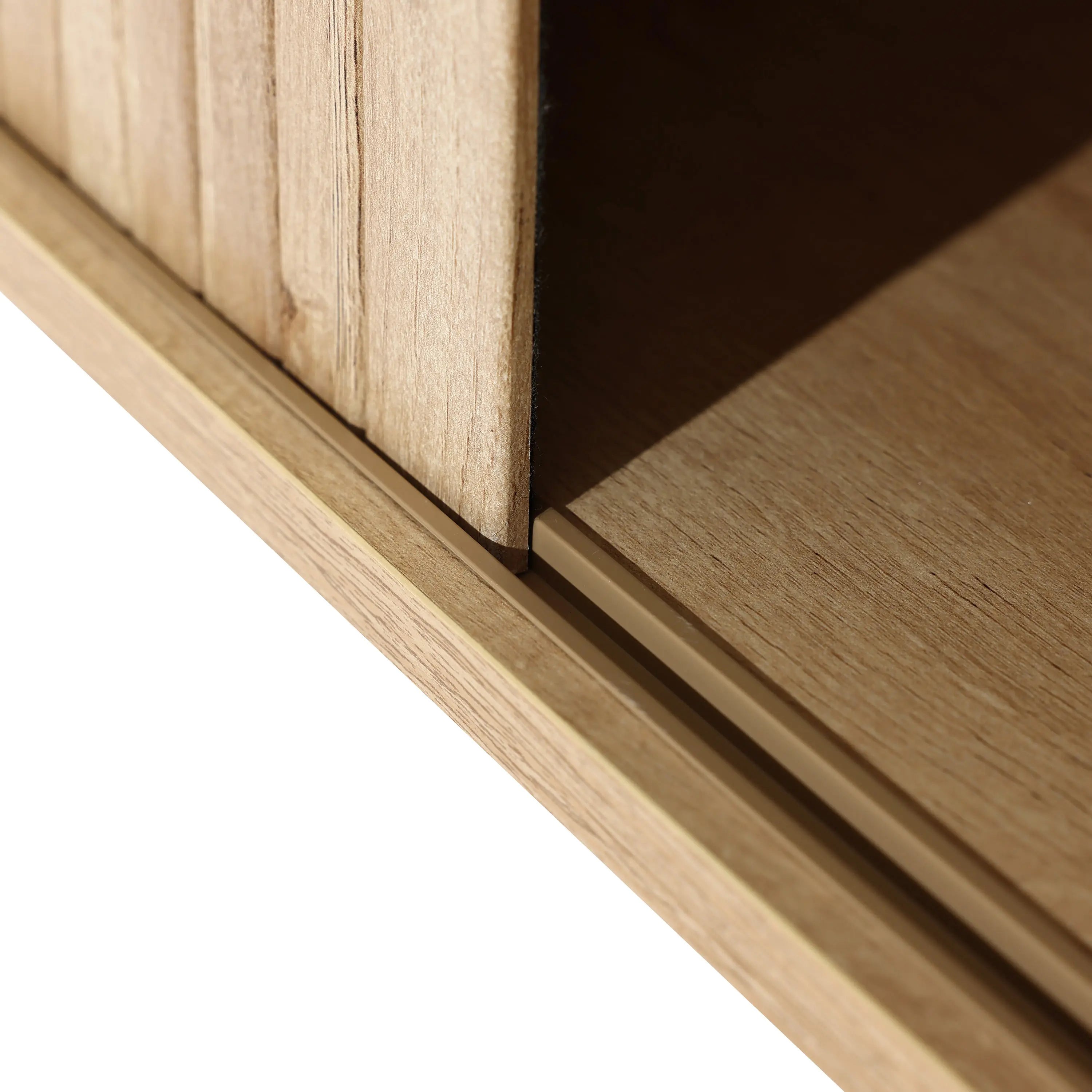 Close-up of a wooden corner on an oak TV stand, showcasing interlocking panels with a natural grain pattern and tambour doors, perfect for supporting a 65-inch TV.