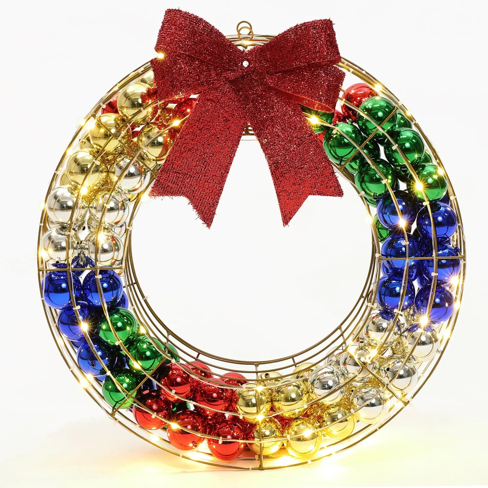 A vibrant holiday wreath with a red bow, featuring gold, silver, red, green, and blue ornaments adorned with LED string lights. Perfect as an outdoor holiday decoration to bring festive cheer.