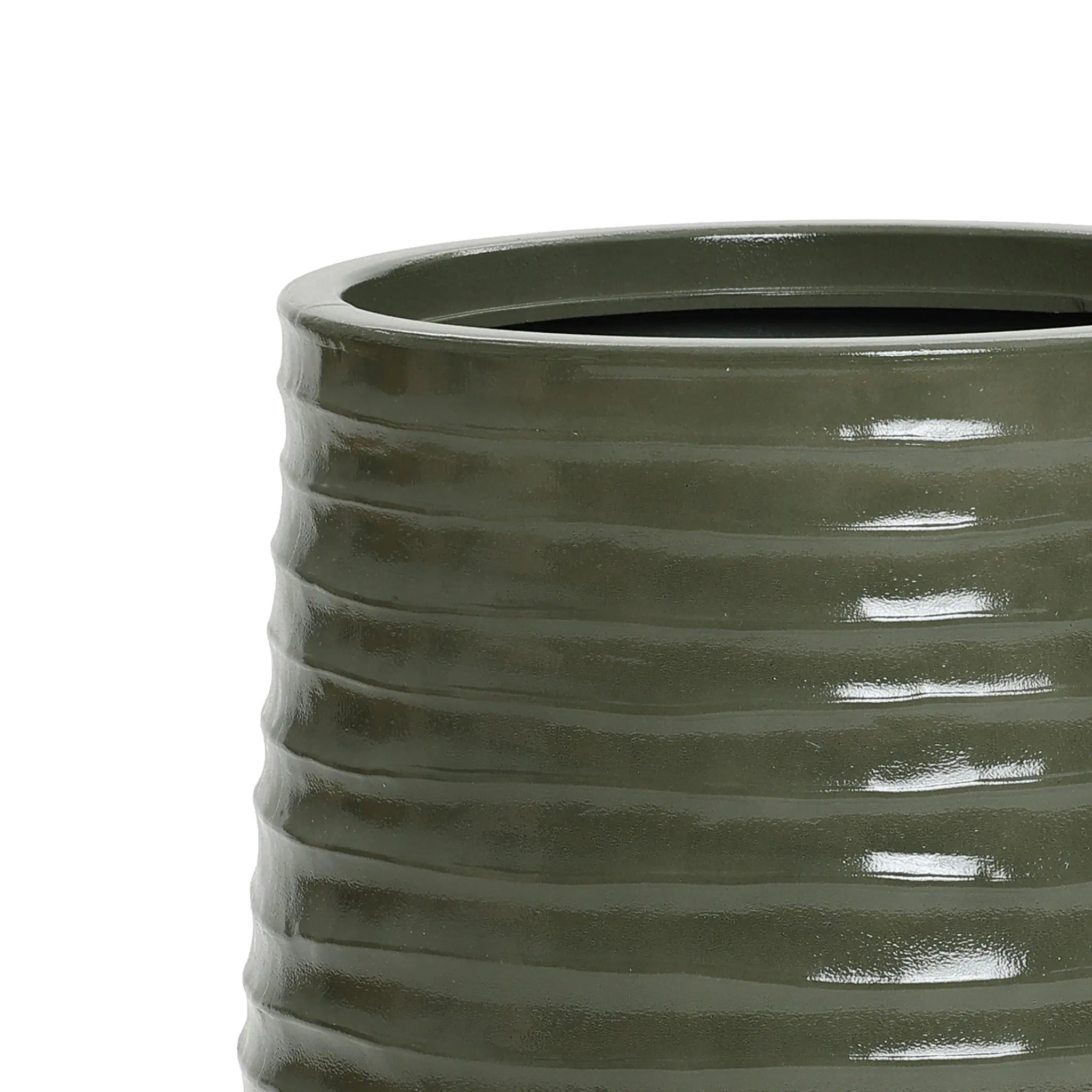A close-up of a green, glossy, ribbed ceramic vase with a cylindrical shape and drainage hole, perfect for both indoor and outdoor environments, set against a plain white background.