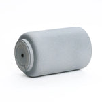A gray, cylindrical aerosol can lies on its side against a plain white background, echoing the sleek lines of modern minimalist decor.