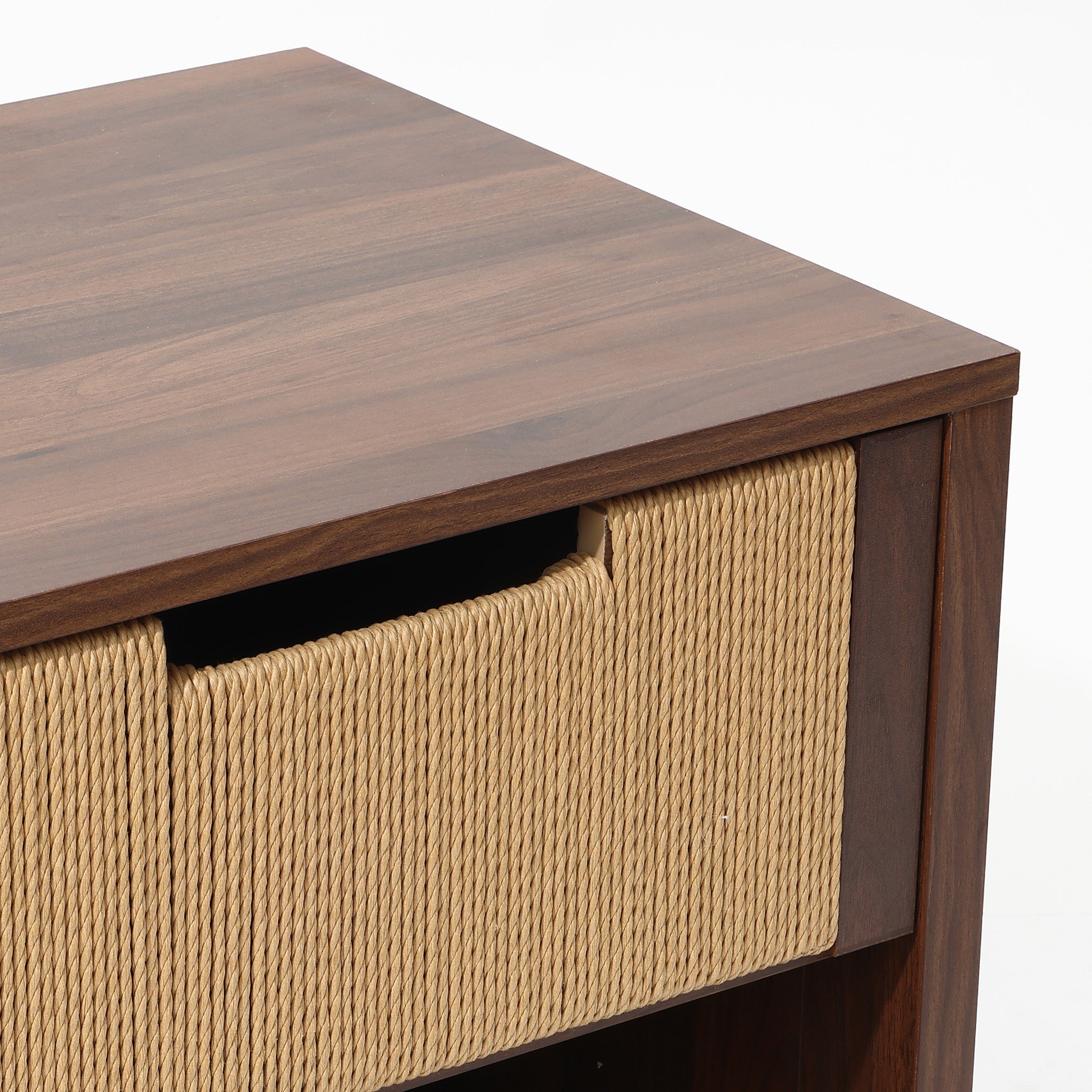 A close-up featuring a end table nightstand with a woven basket drawer partially pulled out.