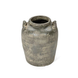 The Fou antique terracotta vase by LuxenHome features a weathered grayish-brown finish with a wide mouth, two small handles on opposite sides, and a textured surface for a rustic, artisanal look. It stands upright on a white background.