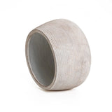 A cylindrical, ribbed, hollow object with a slanted top and open bottom, made from high-quality MgO in a speckled off-white finish. This minimalist design exudes elegance and simplicity.