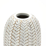 The LuxenHome Modern Geometric Pattern Resin Tall Vase, 13.5 h, features vertical leaf motifs with an antique effect on a soft tan backdrop and oval opening at the top, combining elegance and timeless charm.