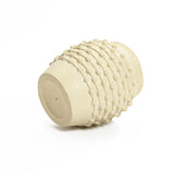 A beige ceramic vase with a textured, bumpy surface lies on its side against a plain white background, showcasing exquisite boho planter vibes.